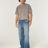 Baggy-Jeans mit Alien-Grafik in mittlerer Waschung
