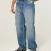 Baggy-Jeans mit Alien-Grafik in mittlerer Waschung