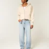 Bestickte, hellblaue Skater-Baggy-Jeans