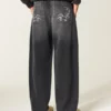 Gewaschene schwarze Baggy-Jeans mit Grafik