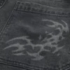 Gewaschene schwarze Baggy-Jeans mit Grafik