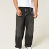 Gewaschene schwarze Baggy-Jeans mit Schlangenstickerei