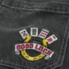 Gewaschene schwarze Skater-Baggy-Jeans mit Good Luck-Stickerei