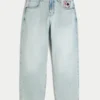 Hellblaue Skater-Baggy-Jeans mit Spielkartengrafik