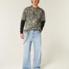 Hellblaue Super-Baggy-Jeans mit Astronauten-Grafik