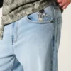 Hellblaue Super-Baggy-Jeans mit Astronauten-Grafik