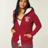 Holiday Vault Release Sherpa-gefütterter Hoodie mit Reißverschluss und Logo-Grafik