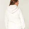 Holiday Vault Release Sherpa-gefütterter Hoodie mit Reißverschluss und Logo-Grafik