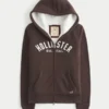 Holiday Vault Release Sherpa-gefütterter Hoodie mit Reißverschluss und Logo-Grafik