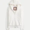 Holiday Vault Release Sherpa-gefütterter Hoodie mit Reißverschluss und Logo-Grafik