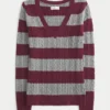 Ikonischer Pullover mit V-Ausschnitt und Zopfmuster