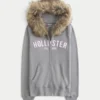 Kapuzenjacke mit Kunstfellbesatz und Logo-Grafik