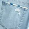 Low-Rise-Jeans mit Rissen, heller Waschung und Stickerei, Bootcut