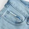 Low-Rise-Jeans mit Rissen, heller Waschung und Stickerei, Bootcut