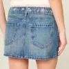 Low-Rise-Minirock aus besticktem Denim