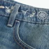 Low-Rise-Minirock aus besticktem Denim
