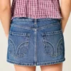 Mini-Skort aus Denim mit niedriger Leibhöhe und Nieten