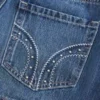 Mini-Skort aus Denim mit niedriger Leibhöhe und Nieten