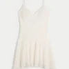 Minikleid mit asymmetrischem Saum und Spitze