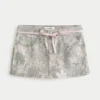 Minirock mit niedriger Taille, rosa Schnürung und Camouflage-Muster