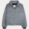 Pufferjacke mit Reißverschlussmuster