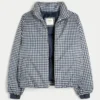 Pufferjacke mit Reißverschlussmuster