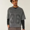 Schweres, baggy geschnittenes, kurzes Football-T-Shirt mit Grafikprint