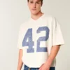 Schweres, baggy geschnittenes, kurzes Football-T-Shirt mit Grafikprint