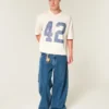 Schweres, baggy geschnittenes, kurzes Football-T-Shirt mit Grafikprint