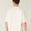 Schweres, baggy geschnittenes, kurzes Football-T-Shirt mit Grafikprint