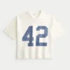 Schweres, baggy geschnittenes, kurzes Football-T-Shirt mit Grafikprint