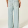 Ultra-niedrige Leibhöhe, hell gewaschen, Baggy-Jeans mit Schnallenverschluss hinten
